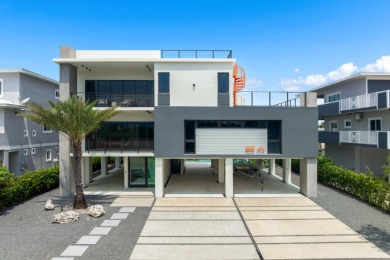 A modern sanctuary on the water, this newly built Key Largo