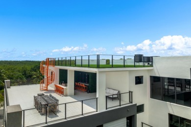A modern sanctuary on the water, this newly built Key Largo