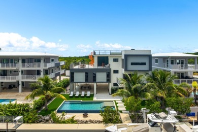 A modern sanctuary on the water, this newly built Key Largo