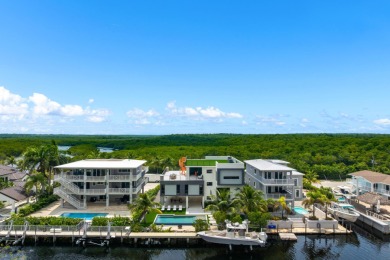 A modern sanctuary on the water, this newly built Key Largo