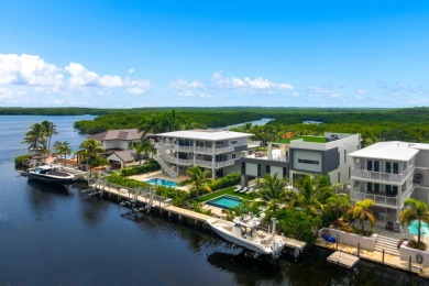 A modern sanctuary on the water, this newly built Key Largo