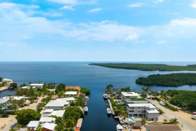 A modern sanctuary on the water, this newly built Key Largo