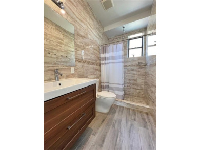 Welcome to this stunning duplex 3-bedroom, 3-bath penthouse with