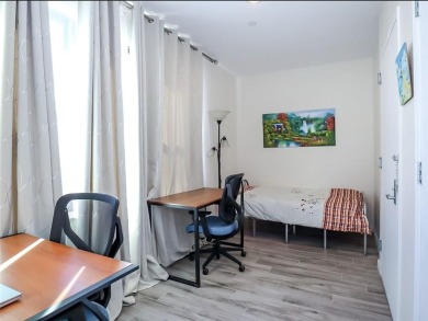 Welcome to this stunning duplex 3-bedroom, 3-bath penthouse with