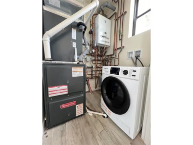 Welcome to this stunning duplex 3-bedroom, 3-bath penthouse with