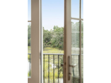 Enjoy light filled marsh front + Ashley River views & downtown