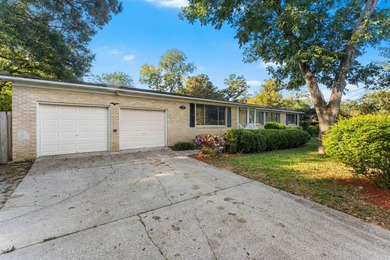 Solid brick 4-bed/2-bath with a flexible nine-room layout-living