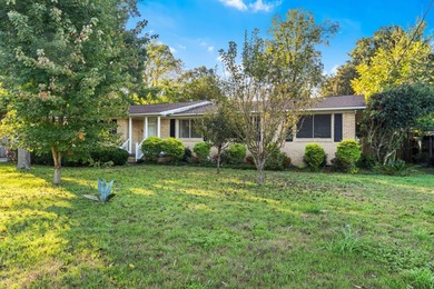 Solid brick 4-bed/2-bath with a flexible nine-room layout-living