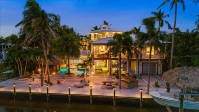 Nestled behind custom gates on nearly 0.83 acres of lushly