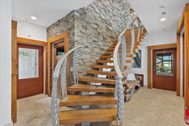 Nestled behind custom gates on nearly 0.83 acres of lushly