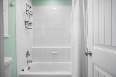 Welcome to this beautifully designed 4-bedroom, 3.5-bath beach