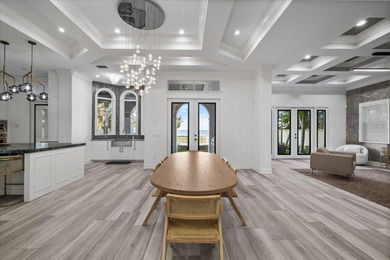 Located within the exclusive gated waterfront community of