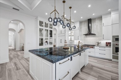 Located within the exclusive gated waterfront community of