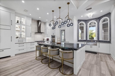 Located within the exclusive gated waterfront community of