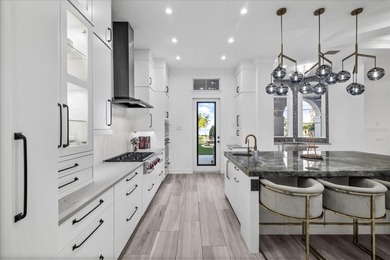 Located within the exclusive gated waterfront community of