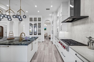 Located within the exclusive gated waterfront community of