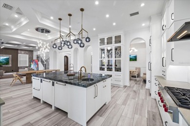 Located within the exclusive gated waterfront community of