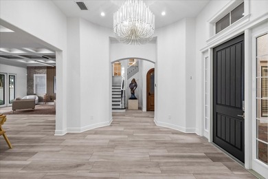 Located within the exclusive gated waterfront community of