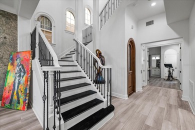 Located within the exclusive gated waterfront community of