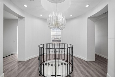 Located within the exclusive gated waterfront community of