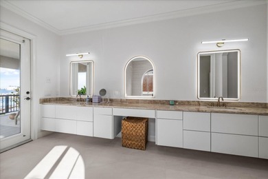 Located within the exclusive gated waterfront community of