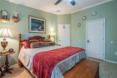 MOTIVATED SELLER! Nestled between lakes and lush greenery is