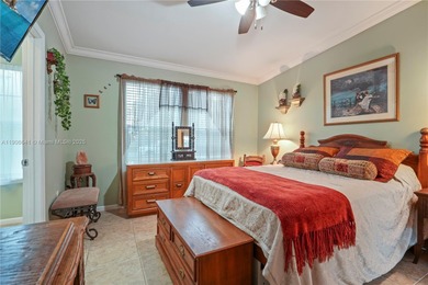 MOTIVATED SELLER! Nestled between lakes and lush greenery is