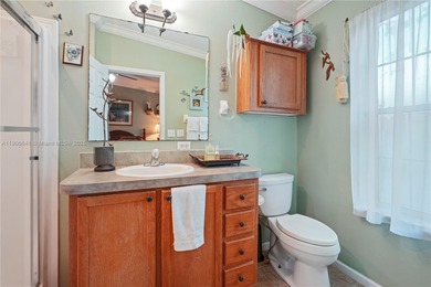 MOTIVATED SELLER! Nestled between lakes and lush greenery is