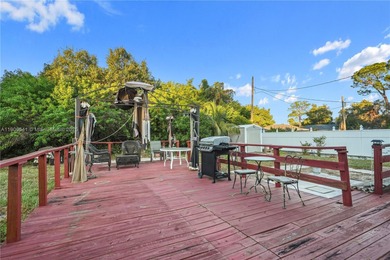 MOTIVATED SELLER! Nestled between lakes and lush greenery is