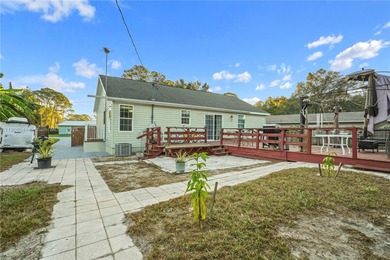 MOTIVATED SELLER! Nestled between lakes and lush greenery is