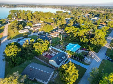 MOTIVATED SELLER! Nestled between lakes and lush greenery is