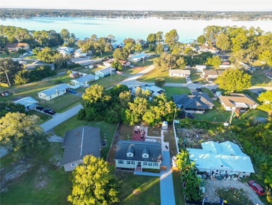 MOTIVATED SELLER! Nestled between lakes and lush greenery is