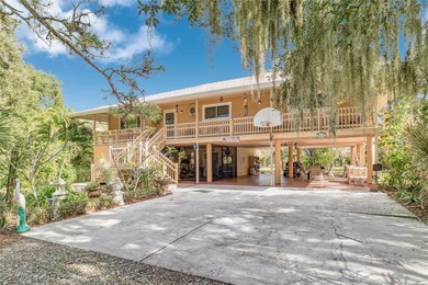 Experience the beauty of Old Florida on 2.4 acres surrounded by