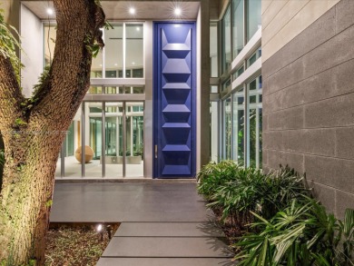 Set on prestigious Rio Vista Boulevard, this modern estate