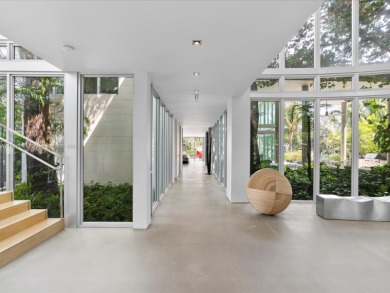 Set on prestigious Rio Vista Boulevard, this modern estate