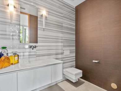 Set on prestigious Rio Vista Boulevard, this modern estate