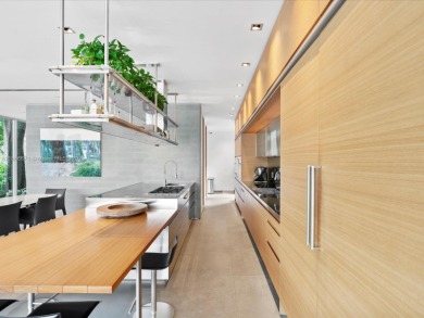 Set on prestigious Rio Vista Boulevard, this modern estate