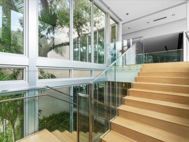 Set on prestigious Rio Vista Boulevard, this modern estate