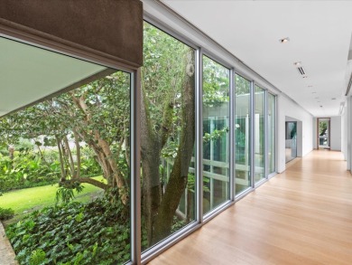 Set on prestigious Rio Vista Boulevard, this modern estate