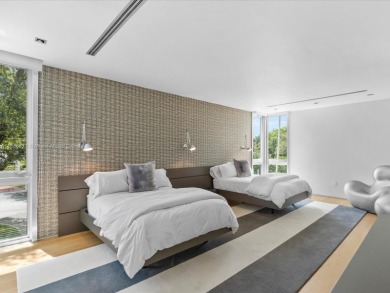 Set on prestigious Rio Vista Boulevard, this modern estate