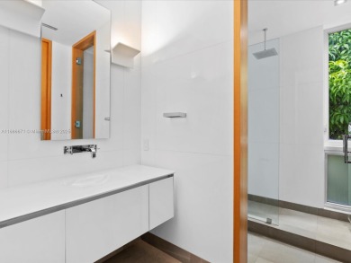 Set on prestigious Rio Vista Boulevard, this modern estate