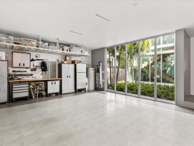 Set on prestigious Rio Vista Boulevard, this modern estate