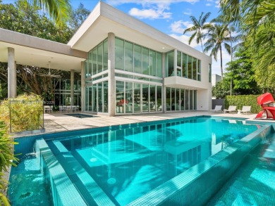 Set on prestigious Rio Vista Boulevard, this modern estate