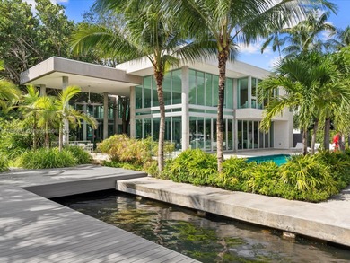 Set on prestigious Rio Vista Boulevard, this modern estate
