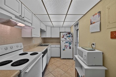 LOVELY, bright and cheerful, second floor garden view unit in