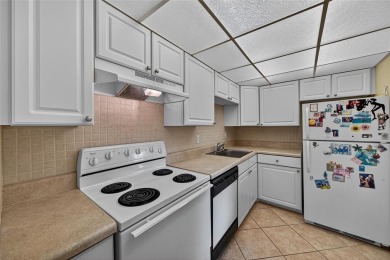 LOVELY, bright and cheerful, second floor garden view unit in