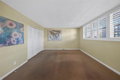 LOVELY, bright and cheerful, second floor garden view unit in