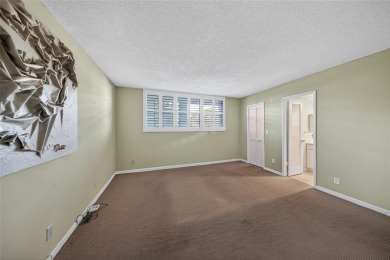 LOVELY, bright and cheerful, second floor garden view unit in