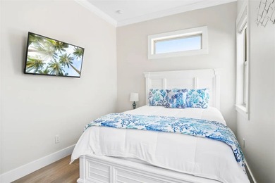 This LUXURIOUS BEACHFRONT smart home has it ALL! Three stories