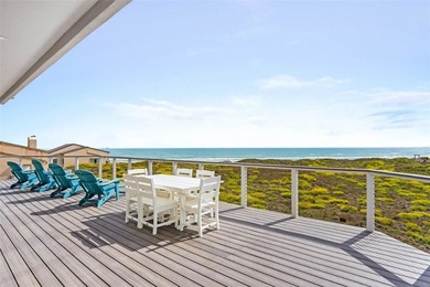 This LUXURIOUS BEACHFRONT smart home has it ALL! Three stories